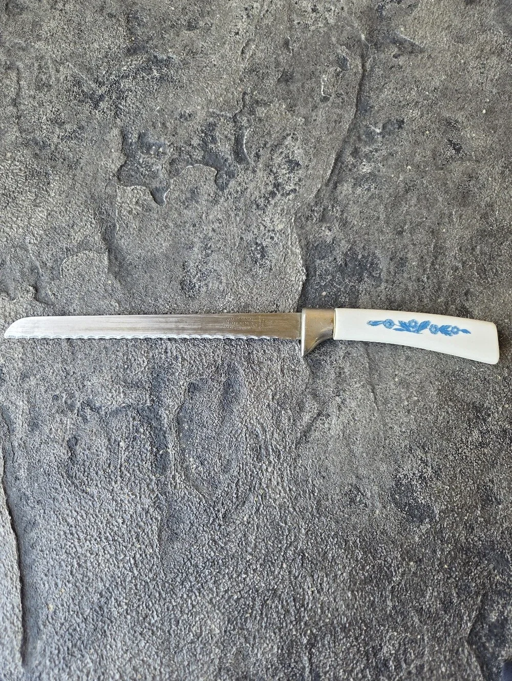 Cornflower Blue Lifetime Cutlery Serrated Table Knife with White Floral Handle